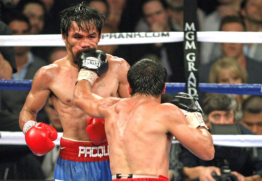 Manny Pacquiao recibe un fuerte golpe de Juan Manuel Márquez. John Gurzinski, Getty Images